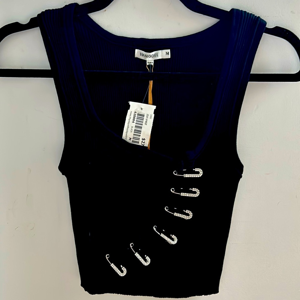 BRAND NEW WITH TAGS 
Black stretch knit top with safety pin detail